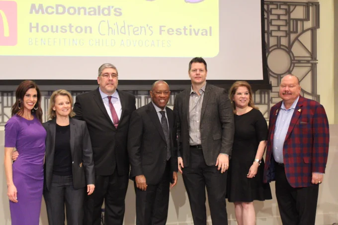 Mayor stands in line with organizers and sponsors