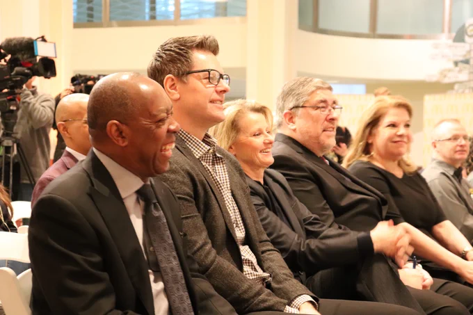 mayor turner sitting in audience laughing 
