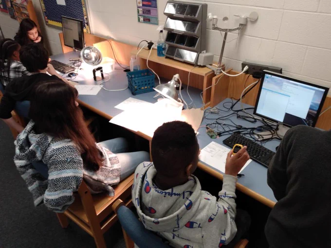 Students completing a science lab with a raspberry pi computer