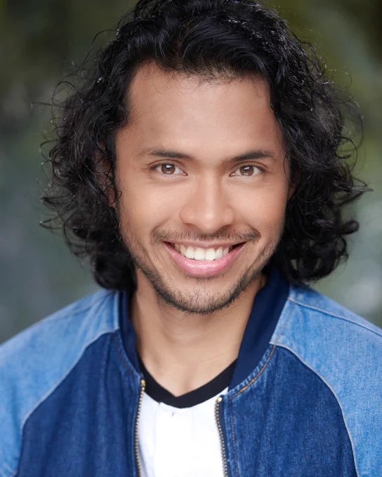 a headshot of Earle Figuracion