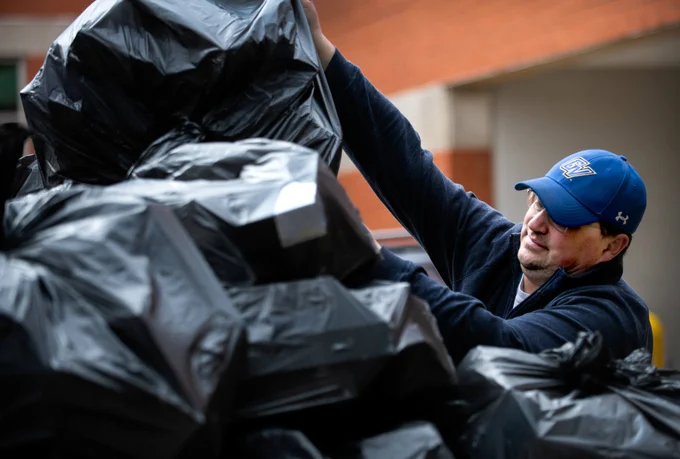 A worker loading up gloves