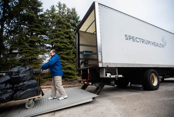 A Spectrum Health truck loading up gloves