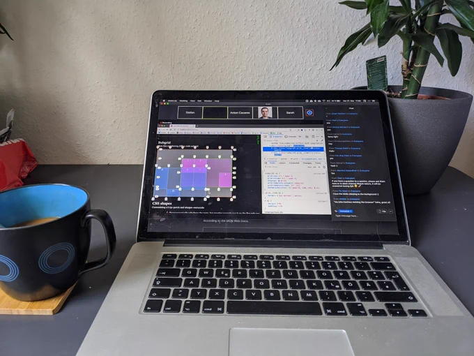 Computer with #frontconf live stream and a coffee