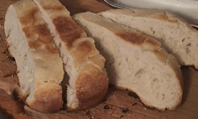 Same loaf upside down after knocking off most burnt stuff was actually good inside.
