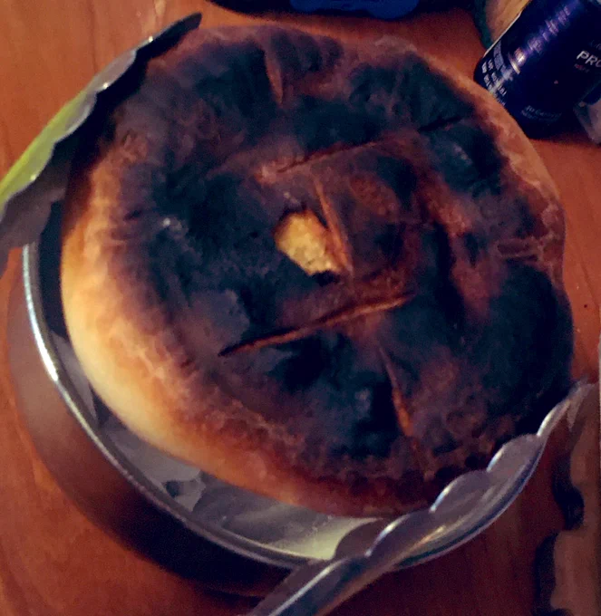 Bun sized tiny loaf all burned on top.