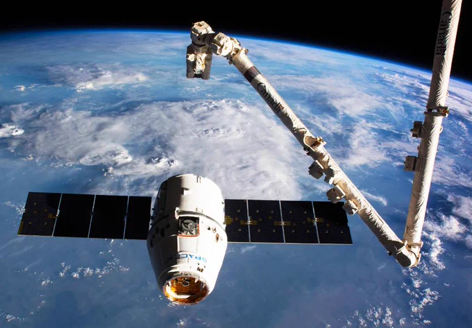 SpaceX Dragon spacecraft and the International Space Station's Canadarm2 robotic arm