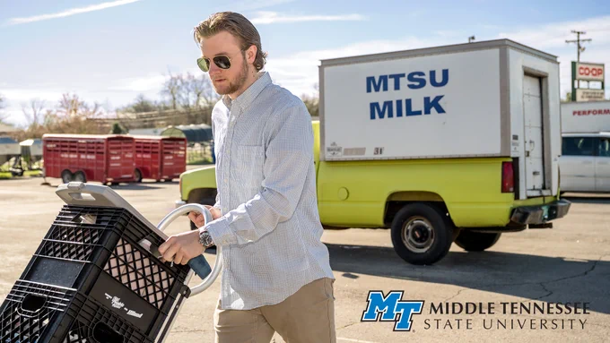 Brendon Puckett delivers fresh MTSU milk from the MTSU Creamery to a local business March 26. MTSU's herd of Jerseys and Holsteins are milked daily by School of Agriculture students and staffers, and the milk is processed and bottled on campus under state-mandated sterile conditions, amid the COVID-19 crisis. ((MTSU photo by J. Intintoli)