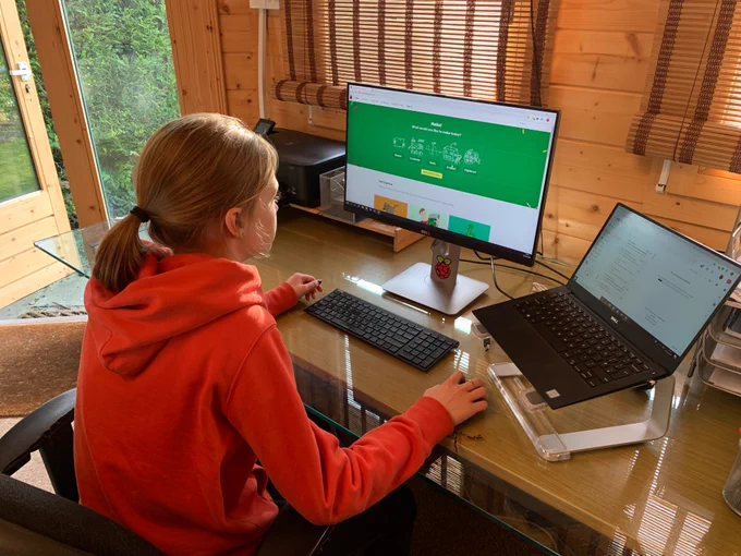 A teenage girl engaging in digital making
