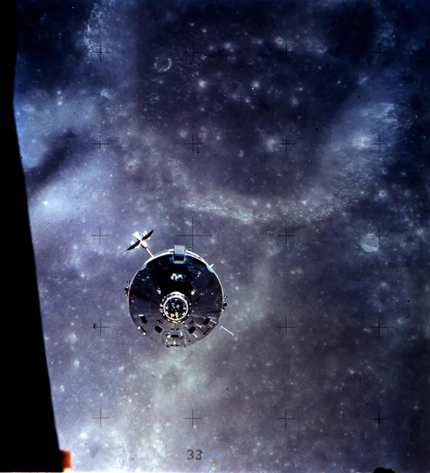 Command and Service Module in front of the Moon. 