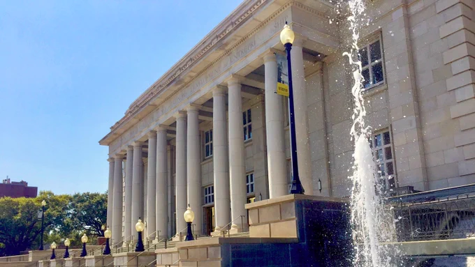 Exterior of the Trent Lott National Center for Excellence in Economic Development and Entrepreneurship at The University of Southern Mississippi with fountain in the foreground.