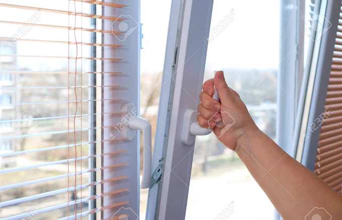 A window that is fixed at the bottom and tilted open at the top.
