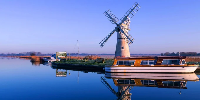 Boat moored alongside thurne mill