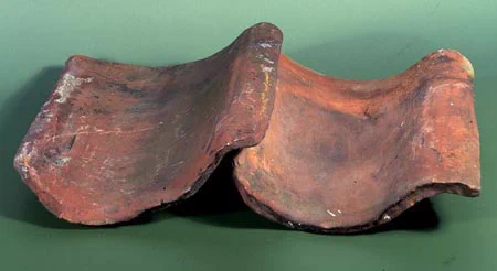 Two well-used pantiles on a table
