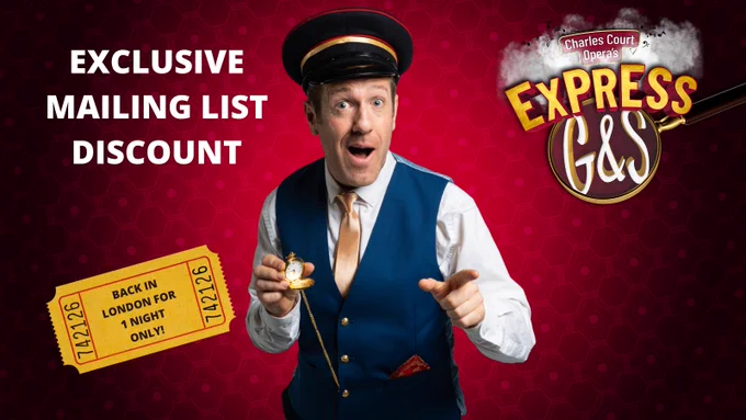 Philip Lee dressed as Reggie the train conductor pointing at the camera.