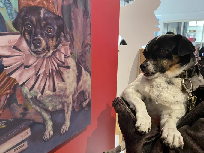 Trixie in real life looking at The painted version of her in a marvellous ruff.