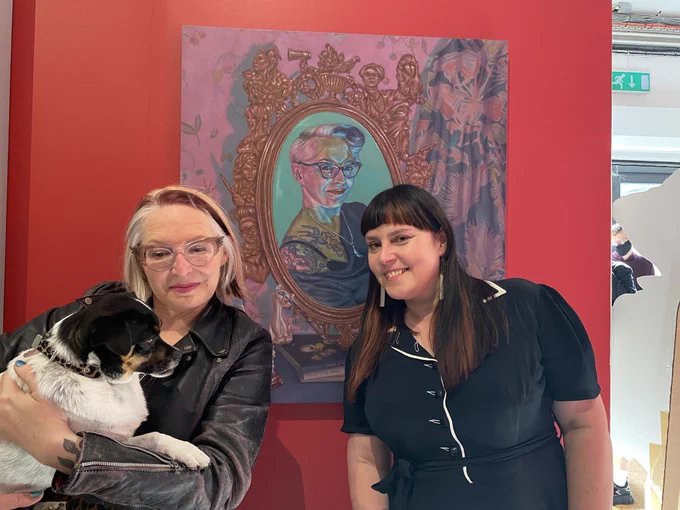 Me and Trixie with Atalanta Kernick in front of painting of me and Trix by Roxana Halls.