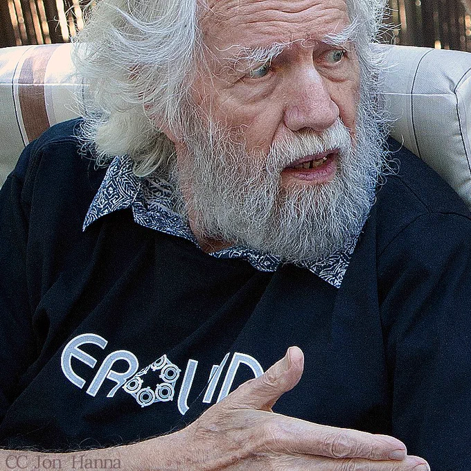 Sasha Shulgin, seated, speaking with friends in 2009 (photo by Jon Hanna)