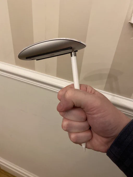 A Mighty Mouse connected to a first gen Apple Pencil.