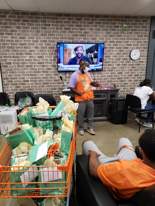 Jacob taking a moment to surpise the associates and thank them for all their hard work and diligence during the pandemic.