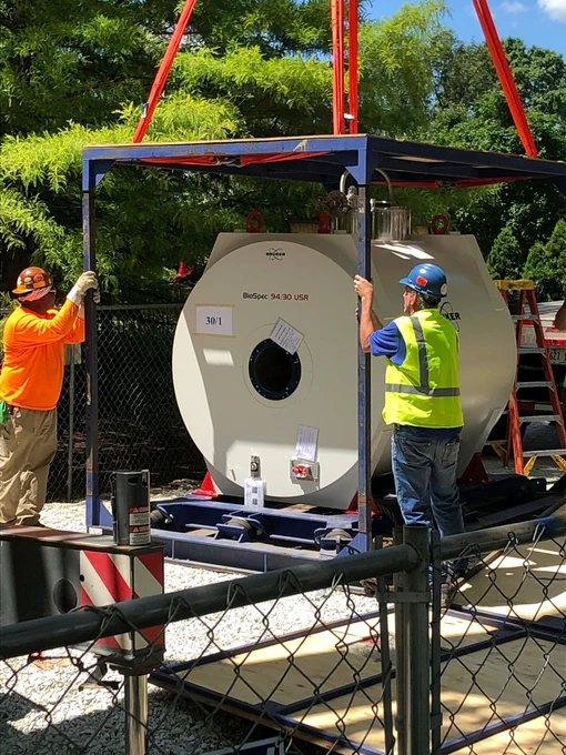 Medium shot of the MRI being unloaded.