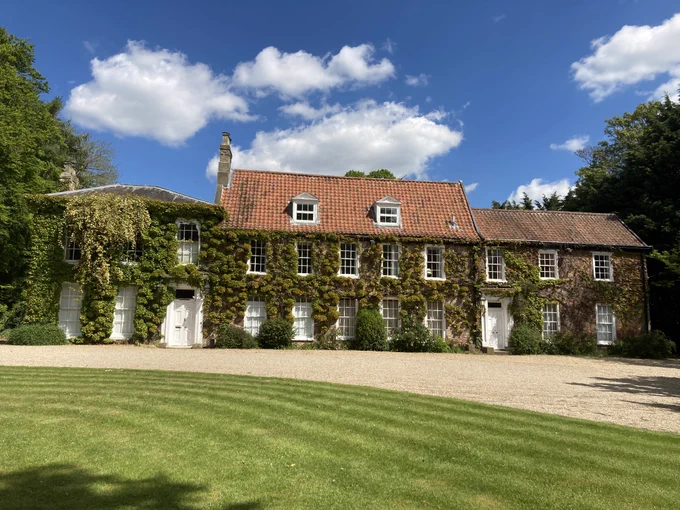 Image of Stower Grange building, with a blue sky in the background. 