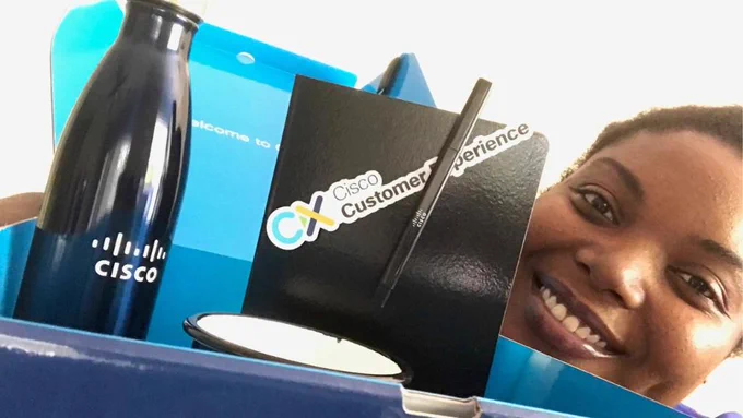 Cisco employee with her Cisco goodies box
