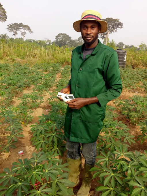 Valentine is using a Chlorophyll meter which measures the chlorophyll content of leaves (more chlorophyll in healthy vigorous plants) without damaging the leaf or having to remove it