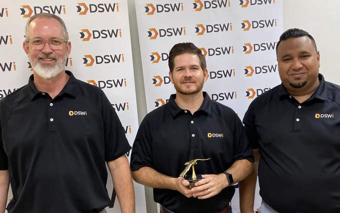 Andy Holdaway, Kyle Collins, and AJ Ansari pose with Eagle Award