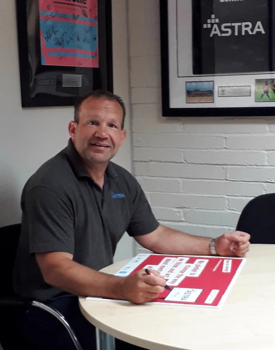 Paul Beet of Astra Security signing the Pledge to support mental health