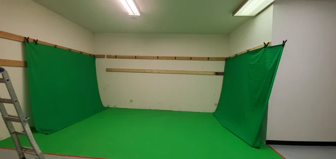 We've set up greenscreens on each side so we can have panoramic backgrounds as well as 3d mocap abilities.