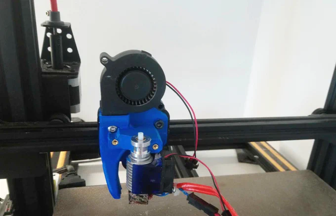 Mount plate with hot end and part cooling fan installed.