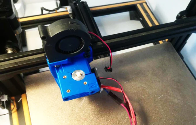 Mount plate with hot end and part cooling fan installed and showing the Nimble V2 extruder mount.