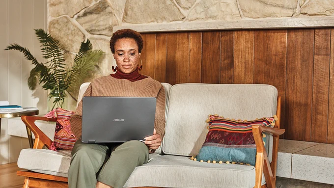 Photograph of a professional woman working from home using her laptop.