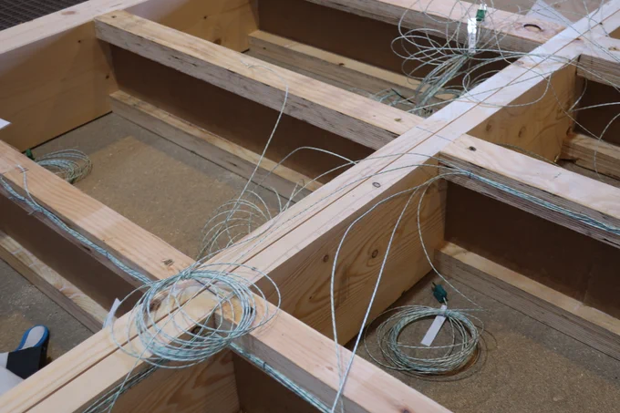 close up picture of test specimen of I-joists, thermocouples and other parts of the set-up