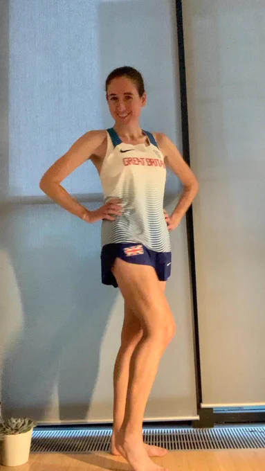 Runner is Great Britain running shorts and singlet top.