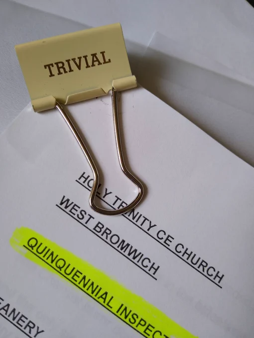 Quinquennial inspection report for Holy Trinity CE Church West Bromwich. Bulldog clip with 'TRIVIAL' label.
