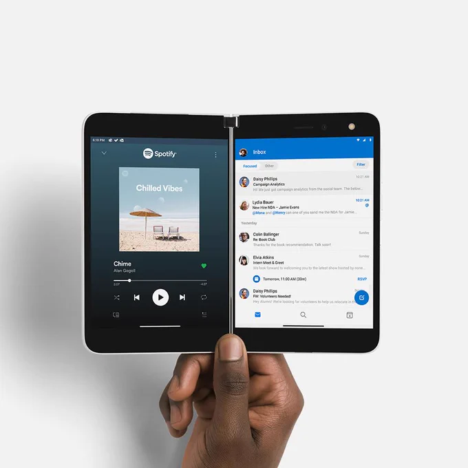 Surface Duo is open with a music app on the left and an email app on the right.