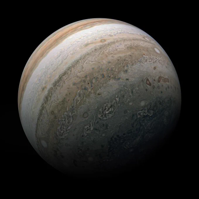 colorful bands of clouds and swirling storms on Jupiter's sphere