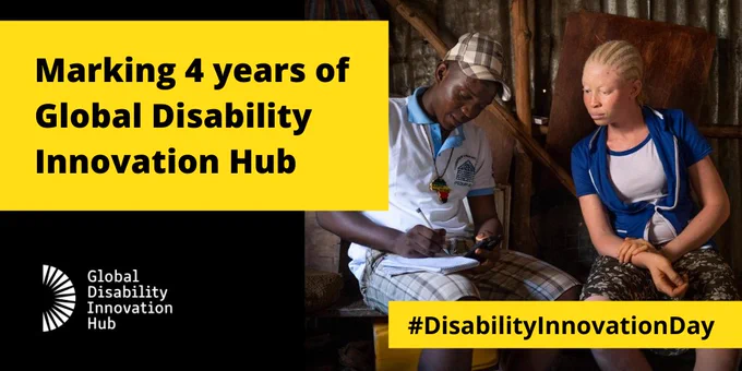  Two people sitting down in a room. One writing on a piece of paper and the other person looking over at it. Text reads: Making 4 years of Global Disability Innovation Hub. #DisabilityInnovationDay. GDI Logo. 