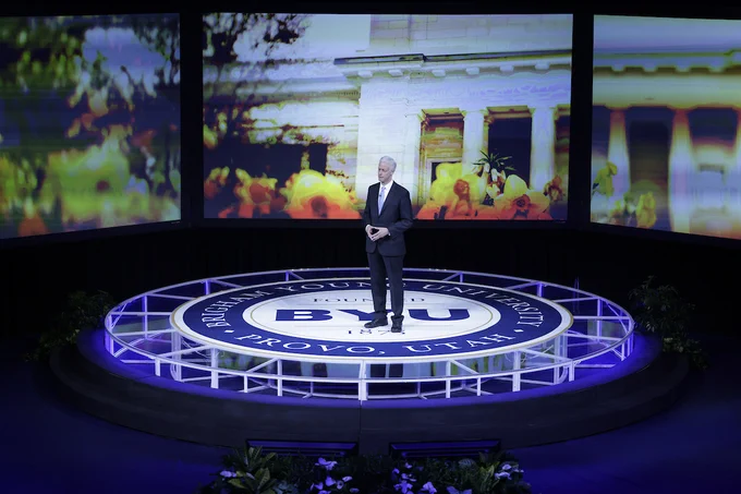 President Kevin J Worthen speaking on a stage at BYU.
