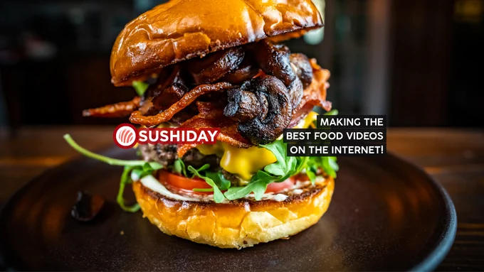 A photo of a bacon burger, with the text: "SushiDay - making the best food videos on the internet!"