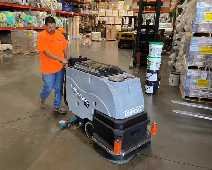 Tomcat Carbon Floor Scrubber Cleans Packaging Facility
