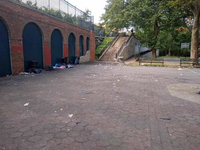 Trash on the ground of the park.