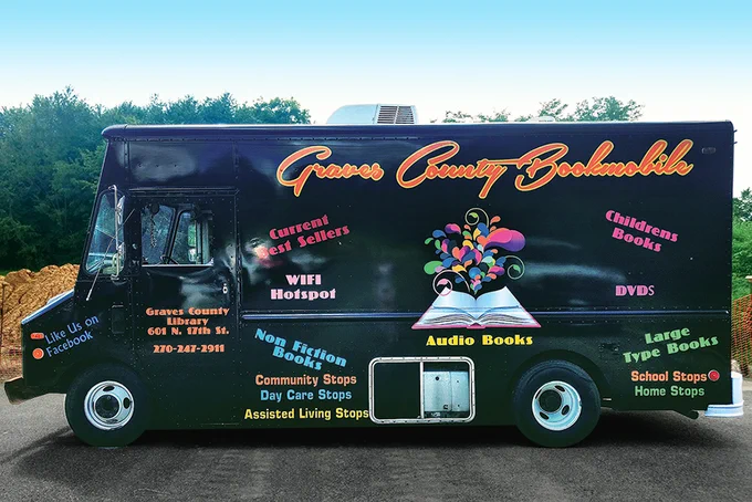 Graves County (Ky.) Public Library's bookmobile -- black panel van with colorful writing on the sides. (Photo: Graves County (Ky.) Public Library)