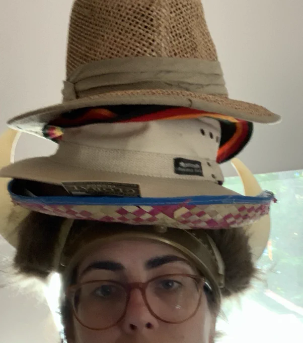 Hats stacked on head