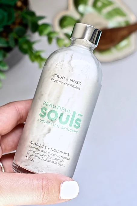 A glass bottle of a scrub and mask enzyme treatment by Beautiful Souls, an Australian skincare brand.  