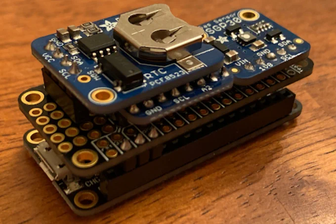 Image description: close up of an air quality sensor made from Arduino boards.