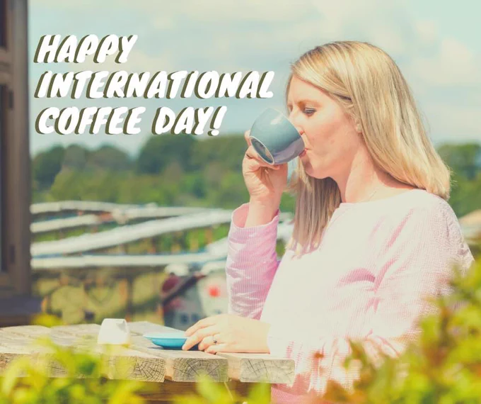 Woman drinking coffee at countryside café