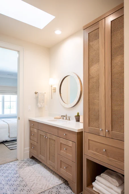 Savoy House Monroe sconce in a bathroom from Raykon Construction via Home Bunch