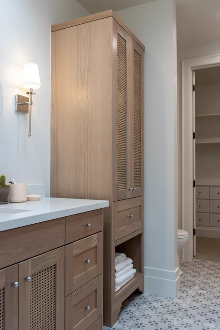 Savoy House Monroe sconce in a bathroom from Raykon Construction via Home Bunch
